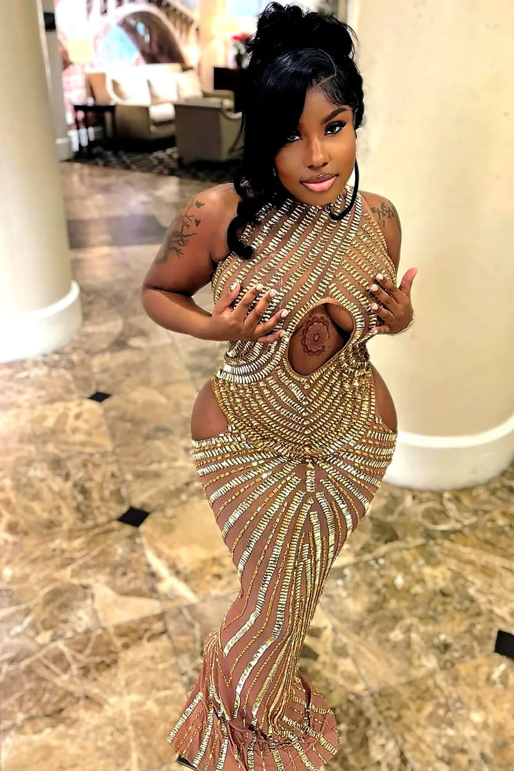Yembi Fashion gold rhinestone maxi dress with dramatic chest and hip cutouts, high neck, and vertical gold crystal line detailing