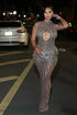 Yembi Fashion nude illusion crystal gown with central chest keyhole cutout, high neck, sheer beige mesh, and geometric vertical lines of silver rhinestones