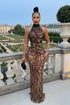 Yembi Fashion black rhinestone maxi dress with nude illusion mesh, high mock neck, and abstract crystal branching patterns