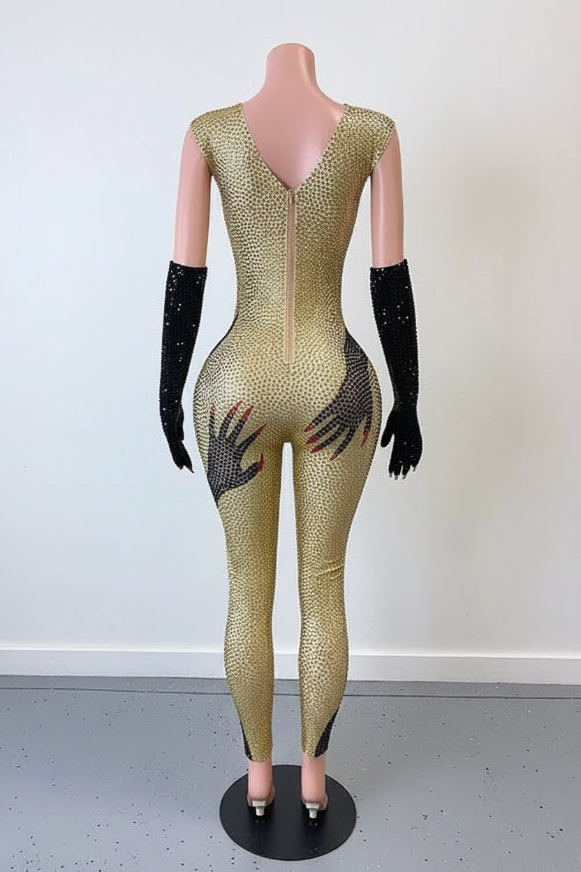 Yembi Fashion luxury gold rhinestone handprint jumpsuit featuring sparkly gold crystals and graphic black hands motif on a bodycon catsuit with matching long gloves
