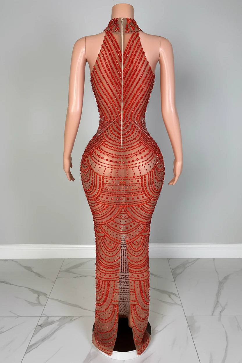 Mannequin wearing a red patterned outfit with a blurred background