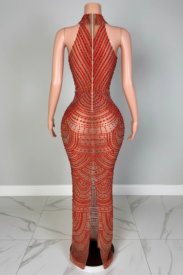 Mannequin wearing a red patterned outfit with a blurred background