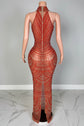 Mannequin wearing a red patterned outfit with a blurred background