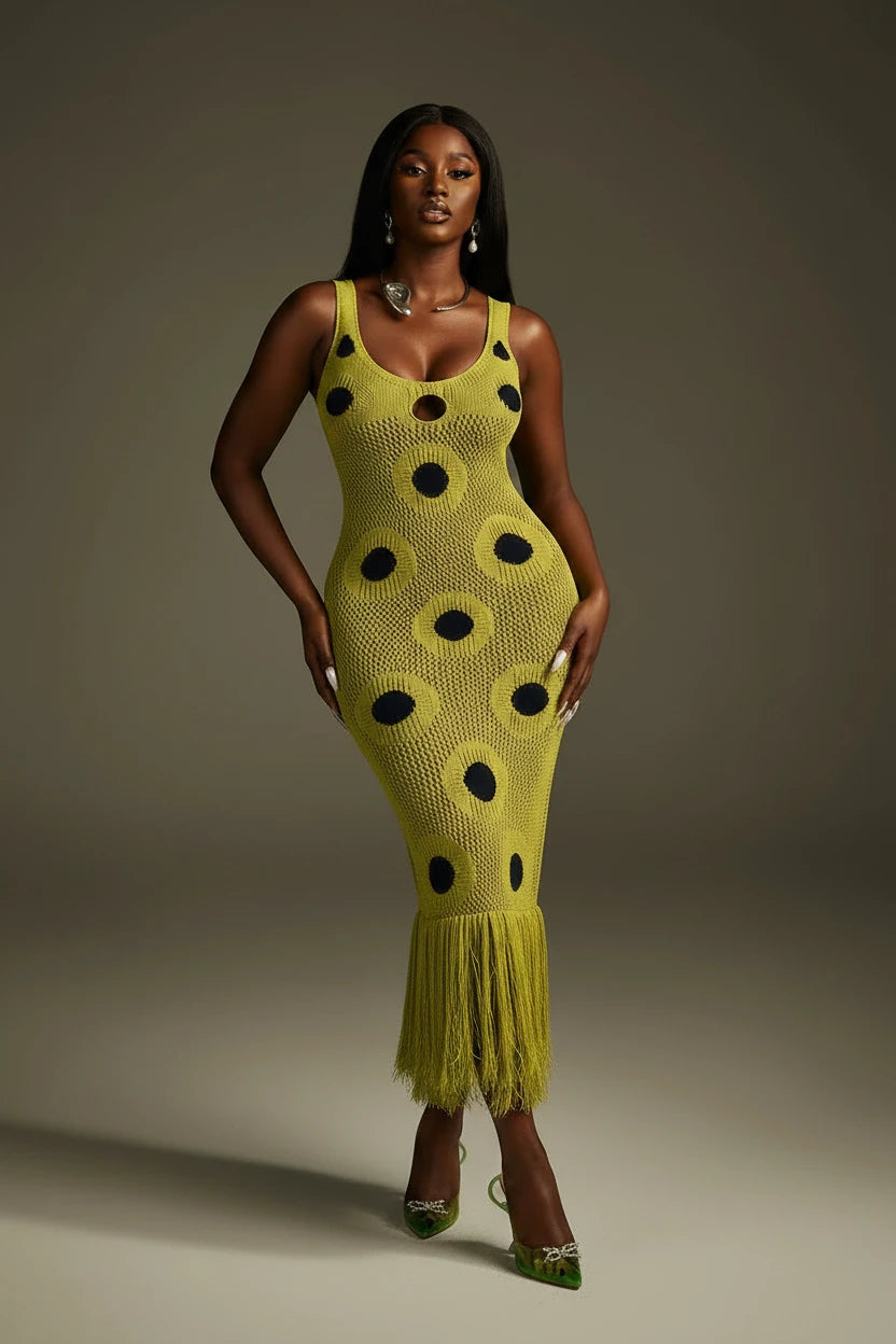 Yembi Fashion luxury olive green polka dot knit maxi dress featuring a chartreuse crochet sleeveless silhouette with black polka dots, center cutout, and a long fringe hem