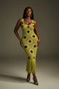 Yembi Fashion luxury olive green polka dot knit maxi dress featuring a chartreuse crochet sleeveless silhouette with black polka dots, center cutout, and a long fringe hem