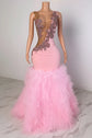 Yembi Fashion pink ruffled mermaid dress with asymmetric bodice, sheer nude-illusion mesh, baroque rhinestone embroidery, and layered tulle skirt