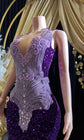 A glamorous embellished sequin dress with rhinestones, featuring a sparkling design perfect for evening wear and formal events