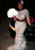 A chic Nina Feather Dress for ladies, featuring white feather detailing, perfect for elegant occasions.