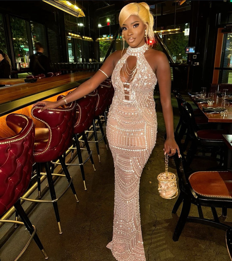 Yembi Fashion silver rhinestone maxi dress with high neck choker collar, plunging cutout bodice, draped chest chains, and sheer nude illusion mesh