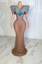 Yembi Fashion crystal embellished mermaid gown with nude illusion rhinestone mesh and structured turquoise off the shoulder wing collar