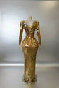 Yembi Fashion gold mirror maxi dress with plunging sweetheart neckline, geometric shattered glass mirror pieces, long sleeves, and high thigh slit
