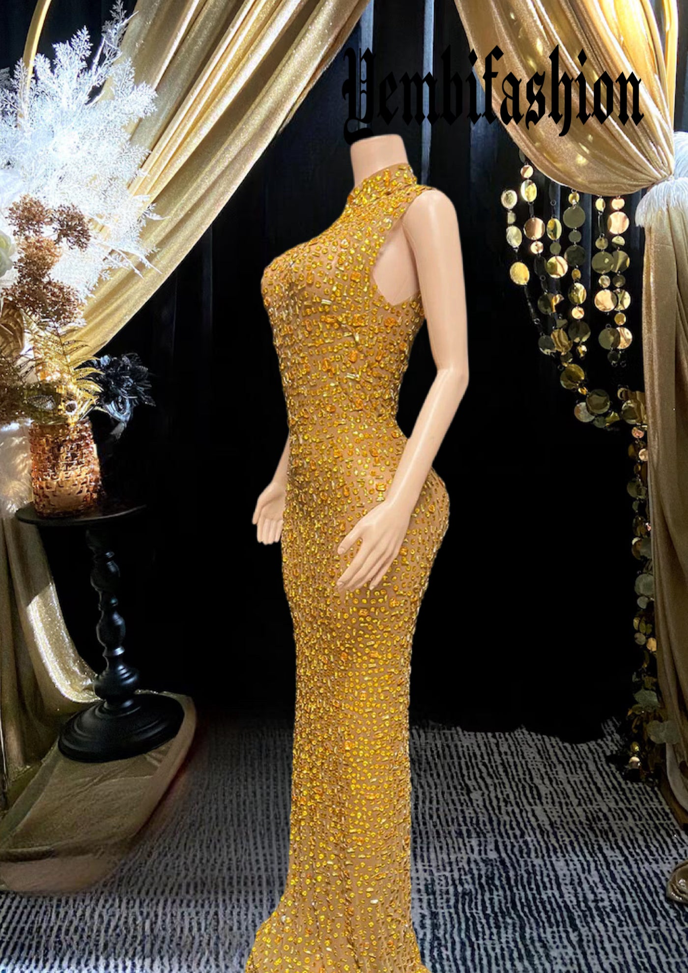 Yembi Fashion yellow crystal maxi dress with high mock neck, sleeveless sheer nude illusion mesh, and heavy constellation pattern of topaz rhinestones