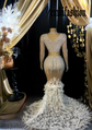 A chic Nina Feather Dress for ladies, featuring white feather detailing, perfect for elegant occasions.