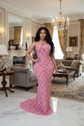Yembi Fashion pink crystal halter dress with criss-cross neckline, central chest keyhole cutout, sheer pink mesh, and geometric diamond grid pattern of rose rhinestones
