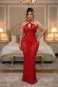 Yembi Fashion red crystal halter dress with criss-cross neckline, central chest keyhole cutout, sheer red mesh, and geometric diamond grid pattern of ruby rhinestones