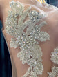 Yembi Fashion silver rhinestone mermaid gown with sheer nude illusion mesh bodice, silver crystal baroque embroidery, and fluid liquid satin train skirt
