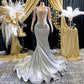 Yembi Fashion silver rhinestone mermaid gown with sheer nude illusion mesh bodice, silver crystal baroque embroidery, and fluid liquid satin train skirt