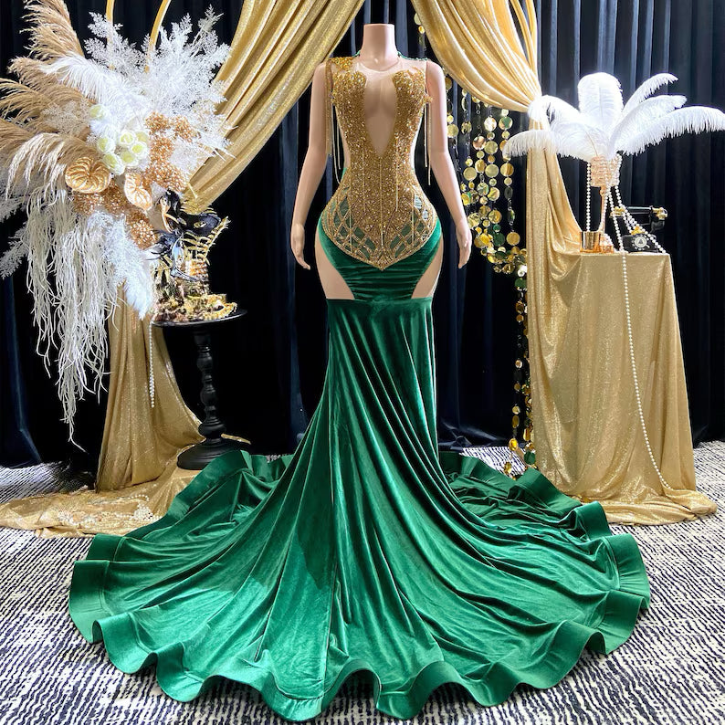 Yembi Fashion green velvet mermaid gown with gold crystal embellished bodice, shoulder fringe tassels, sheer nude illusion hip cutouts, and emerald velour train
