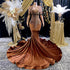 Yembi Fashion brown velvet mermaid gown with high neck, long sheer mesh sleeves, heavy bronze crystal baroque embroidery, and rich chocolate velour train