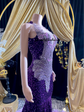 A glamorous embellished sequin dress with rhinestones, featuring a sparkling design perfect for evening wear and formal events