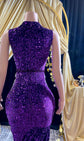 A glamorous embellished sequin dress with rhinestones, featuring a sparkling design perfect for evening wear and formal events
