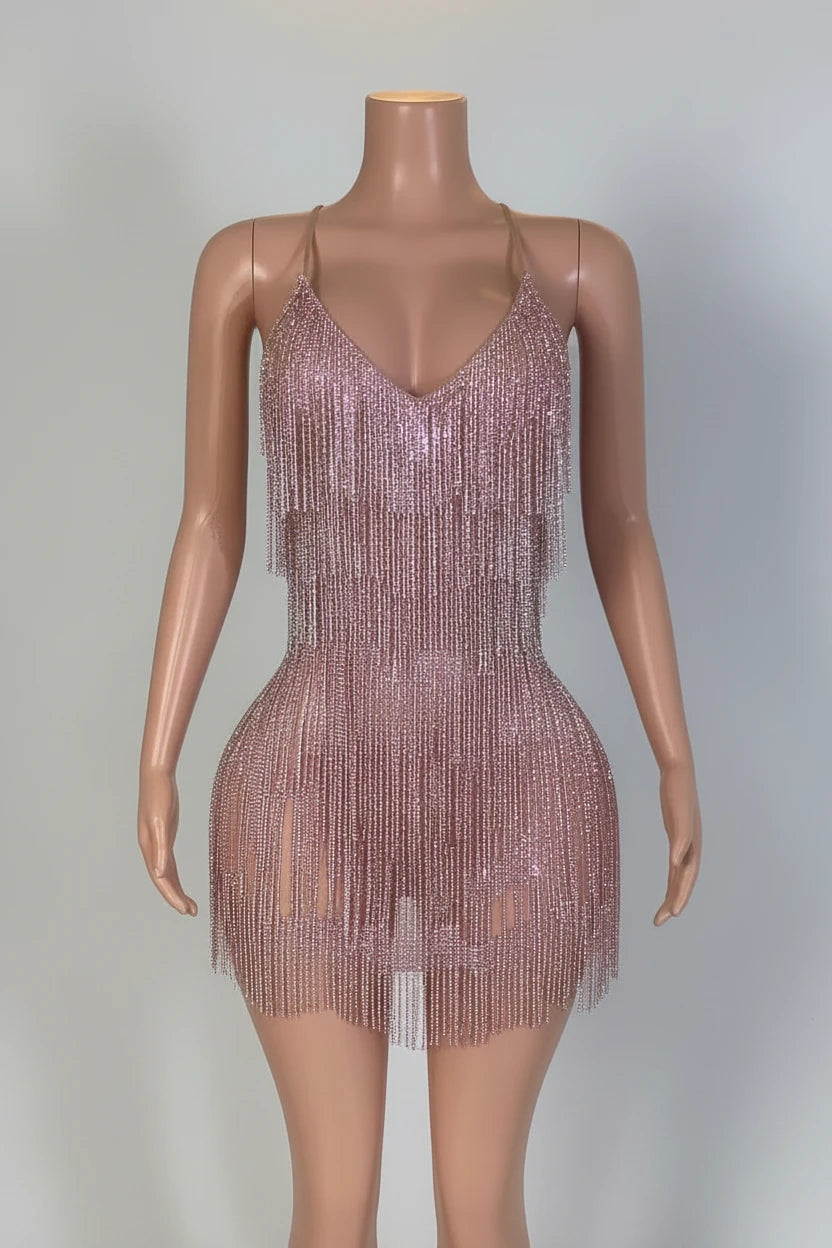 Yembi Fashion pink rhinestone fringe mini dress with V-neckline, sheer nude illusion mesh, and vertical hanging crystal tassel strands