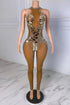 Yembi Fashion luxury silver mirror jumpsuit featuring an architectural pattern of reflective silver mirror shards and scattered crystals on a nude illusion halter neck catsuit