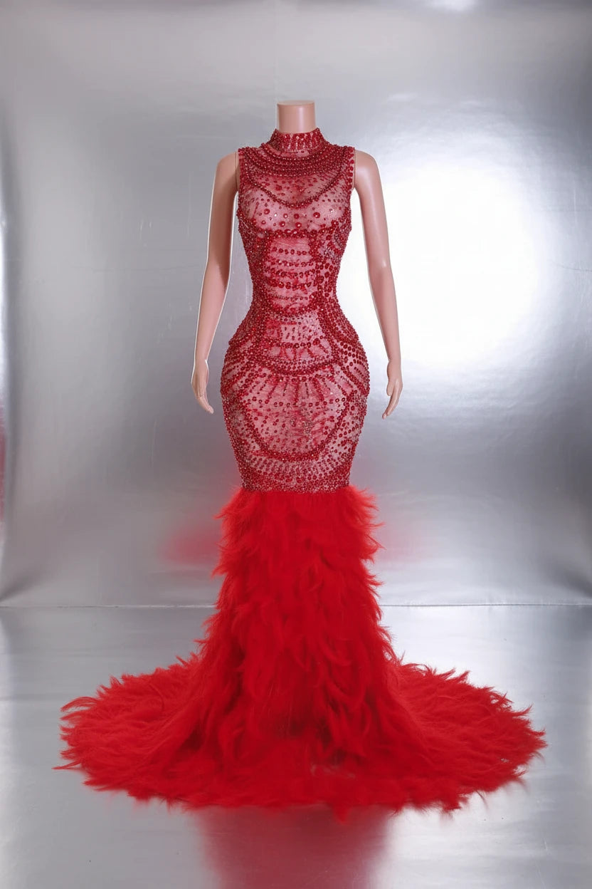 Yembi Fashion red feather crystal gown with high mock neck, nude illusion mesh bodice with ruby pearl beadwork, and plush ostrich feather mermaid train