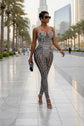 Yembi Fashion black crystal jumpsuit with strapless sweetheart neckline, sheer black nude illusion mesh, and heavy linear silver rhinestone embellishments