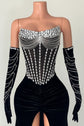 Yembi Fashion black velvet maxi dress with strapless sheer mesh corset bodice, vertical silver rhinestone lines, draped chest body chains, and matching embellished velvet gloves