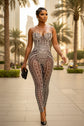 Yembi Fashion black crystal jumpsuit with strapless sweetheart neckline, sheer black nude illusion mesh, and heavy linear silver rhinestone embellishments