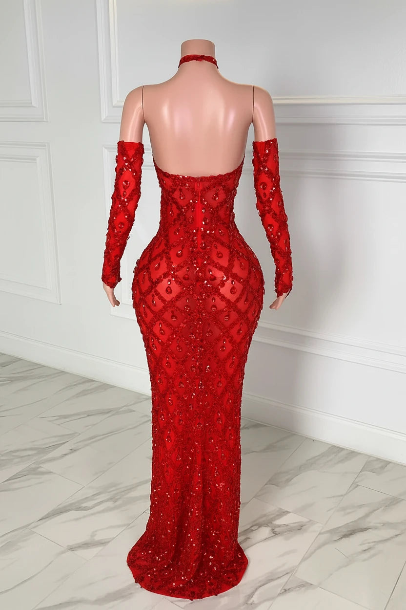 Yembi Fashion red crystal halter dress with criss-cross neckline, central chest keyhole cutout, sheer red mesh, and geometric diamond grid pattern of ruby rhinestones