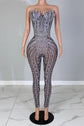 Yembi Fashion black crystal jumpsuit with strapless sweetheart neckline, sheer black nude illusion mesh, and heavy linear silver rhinestone embellishments