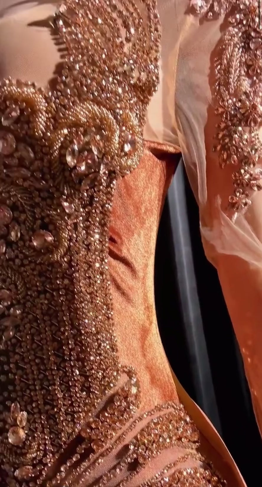 Yembi Fashion brown velvet mermaid gown with high neck, long sheer mesh sleeves, heavy bronze crystal baroque embroidery, and rich chocolate velour train