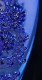 A stunning royal blue embellished mini dress with sparkling rhinestones, ideal for prom or formal events.