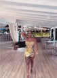 Model wearing a glamorous Rhinestone Dress Set with tassel dress details, perfect for special occasions."