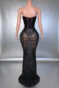 Yembi Fashion black rhinestone mermaid gown with strapless corset bodice, sheer nude-illusion mesh, and heavy geometric crystal beading