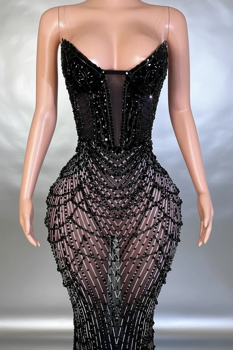 Yembi Fashion black rhinestone mermaid gown with strapless corset bodice, sheer nude-illusion mesh, and heavy geometric crystal beading