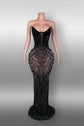 Yembi Fashion black rhinestone mermaid gown with strapless corset bodice, sheer nude-illusion mesh, and heavy geometric crystal beading