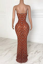 Yembi Fashion burnt orange crystal maxi dress with strapless neckline, sheer nude illusion mesh waist cutouts, silver rhinestones, and high thigh slit